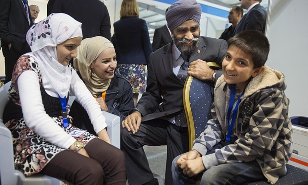 Canada's Minister of National Defense, Harjit Sajjan meets the first Syrian refugee group that will eventually total 10,000 by the end of 2015.